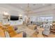 Spacious living room with views of the backyard, with water, and with an adjacent conversation area at 472 Desoto Dr, New Smyrna Beach, FL 32169