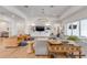 Open-concept living room featuring hardwood floors and stylish furnishings at 472 Desoto Dr, New Smyrna Beach, FL 32169