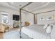 A beautifully styled main bedroom features a four poster bed and light, airy decor at 472 Desoto Dr, New Smyrna Beach, FL 32169