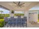 Outdoor bar with ample seating, built-in grill, and refreshing outdoor shower nearby at 472 Desoto Dr, New Smyrna Beach, FL 32169
