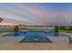 Beautiful pool area with waterfront views offering a luxurious relaxation and entertainment space at 472 Desoto Dr, New Smyrna Beach, FL 32169