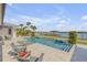 Inviting pool and patio area with comfortable seating and peaceful waterfront views at 472 Desoto Dr, New Smyrna Beach, FL 32169