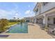 Beautiful pool and patio area with comfortable seating and scenic waterfront views at 472 Desoto Dr, New Smyrna Beach, FL 32169