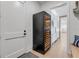 Stylish wine room with a large wine cooler, adding luxury and convenience at 472 Desoto Dr, New Smyrna Beach, FL 32169