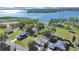 Aerial view showcasing the property's proximity to the lake, green landscape, and neighborhood at 917 E Valencia St, Lakeland, FL 33805
