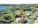 Aerial shot with arrow, showcasing proximity to the lake and surrounded by greenery and neighborhood amenities at 917 E Valencia St, Lakeland, FL 33805