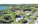 Aerial shot with view of the lake and buildings in the distance, surrounded by trees and green spaces at 917 E Valencia St, Lakeland, FL 33805
