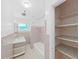 A quaint bathroom featuring a shower and tub, as well as a sink, toilet, and storage at 917 E Valencia St, Lakeland, FL 33805