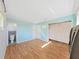 Light blue bedroom features updated flooring, large closet, and ensuite bath at 917 E Valencia St, Lakeland, FL 33805