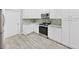 Updated kitchen features stainless appliances and white cabinets at 917 E Valencia St, Lakeland, FL 33805