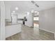 Beautifully updated, the kitchen has all white cabinets and modern stainless steel appliances at 917 E Valencia St, Lakeland, FL 33805