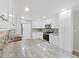 Bright kitchen with white cabinets, stainless appliances, and granite countertops at 917 E Valencia St, Lakeland, FL 33805