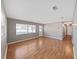 Bright living room with hardwood floors, gray walls, and a large window providing ample natural light at 917 E Valencia St, Lakeland, FL 33805