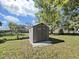 Backyard shed with double doors and windows, providing extra storage at 917 E Valencia St, Lakeland, FL 33805