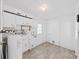 Utility room with white cabinets and laminate flooring at 917 E Valencia St, Lakeland, FL 33805