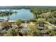 Aerial view of the house and neighborhood showing the lake in the background with property boundary lines at 1730 John Arthur Way, Lakeland, FL 33803