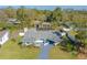 Aerial view of a well-kept home featuring a screened pool and fenced yard in a leafy neighborhood at 1730 John Arthur Way, Lakeland, FL 33803