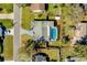 Aerial view of the home showcasing the landscaping, pool, and backyard with boundary lines added at 1730 John Arthur Way, Lakeland, FL 33803