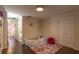 A bedroom with a toddler bed, a pink rug, and a closet at 1730 John Arthur Way, Lakeland, FL 33803