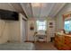 Bedroom with white plank walls, neutral carpet, and a window at 1730 John Arthur Way, Lakeland, FL 33803