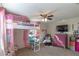 A colorful bedroom with a loft bed, chair, dresser, and carpet flooring at 1730 John Arthur Way, Lakeland, FL 33803