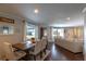 Inviting dining area with a wood table set, and an open view to the adjacent living room at 1730 John Arthur Way, Lakeland, FL 33803