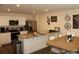 Well-lit kitchen with stainless steel appliances and countertop dining at 1753 Eagle Hammock Blvd, Eagle Lake, FL 33839