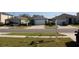 Neighborhood street view showcasing several single-Gathering homes with well-manicured lawns at 1753 Eagle Hammock Blvd, Eagle Lake, FL 33839