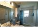 Bright bathroom with a shower-tub combination and a vanity with a marble countertop at 891 Galloway St, Lake Alfred, FL 33850