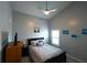 Cozy bedroom with neutral paint, tile floors, and great natural light from the window at 891 Galloway St, Lake Alfred, FL 33850