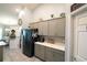 Spacious kitchen with black refrigerator, pantry and white countertops at 891 Galloway St, Lake Alfred, FL 33850