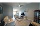 Inviting living room featuring vaulted ceiling, fan, and tile flooring at 891 Galloway St, Lake Alfred, FL 33850