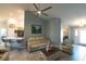 Cozy living room with a ceiling fan and an open layout at 891 Galloway St, Lake Alfred, FL 33850