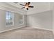 Spacious bedroom with tray ceilings, carpet floors, and ample natural light at 17416 Magnolia Island Blvd, Clermont, FL 34711