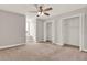 Neutral bedroom showcases two large closets and a window with a window seat at 17416 Magnolia Island Blvd, Clermont, FL 34711