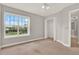 Bedroom featuring a large window and closet with sliding doors at 17416 Magnolia Island Blvd, Clermont, FL 34711