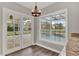 Breakfast nook with granite counters and view of the pool and patio through large windows at 17416 Magnolia Island Blvd, Clermont, FL 34711