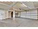 Spacious garage featuring high ceilings, ample storage, and convenient access to utilities at 17416 Magnolia Island Blvd, Clermont, FL 34711
