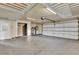 Spacious, clean garage with ample storage, shelving and water treatment system at 17416 Magnolia Island Blvd, Clermont, FL 34711