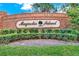 Beautifully landscaped entrance sign for the Magnolia Island community at 17416 Magnolia Island Blvd, Clermont, FL 34711