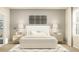 Bright bedroom featuring neutral tones, two bedside tables, and a decorative headboard at 3111 Zuni Rd, St Cloud, FL 34771