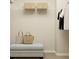 Organized closet featuring shelving, storage baskets and a comfortable ottoman bench at 3111 Zuni Rd, St Cloud, FL 34771