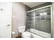 Updated gray toned bathroom with a tub shower at 4739 Tierra Alta Ct, Lakeland, FL 33813