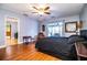 Bright bedroom with wood floors, ceiling fan, and sliding doors leading to the outside at 4739 Tierra Alta Ct, Lakeland, FL 33813