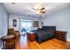 Bedroom with wood floors, ceiling fan, and sliding doors leading to the outside patio at 4739 Tierra Alta Ct, Lakeland, FL 33813