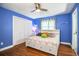 Bright bedroom with wood floors, ceiling fan, and neutral color paint at 4739 Tierra Alta Ct, Lakeland, FL 33813