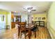 Bright dining area with hardwood floors, table with bench and ceiling fan at 4739 Tierra Alta Ct, Lakeland, FL 33813