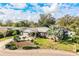 Overhead view of a quaint house nestled among lush greenery, highlighting its charming architecture and landscaping at 4739 Tierra Alta Ct, Lakeland, FL 33813