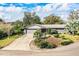 Beautiful exterior shot of a home, showcasing its manicured lawn and the driveway leading to the attached garage at 4739 Tierra Alta Ct, Lakeland, FL 33813