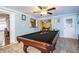 Entertaining game room featuring a billiards table and views into the kitchen at 4739 Tierra Alta Ct, Lakeland, FL 33813